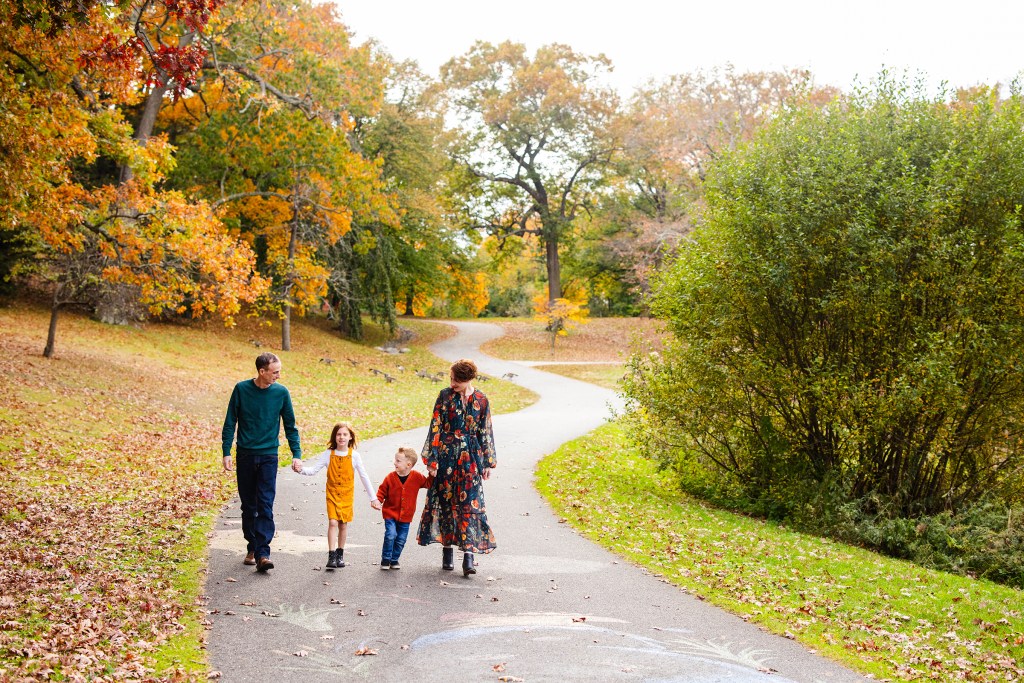 Family walking at their mini session in Roger Williams Park in Providence, RI