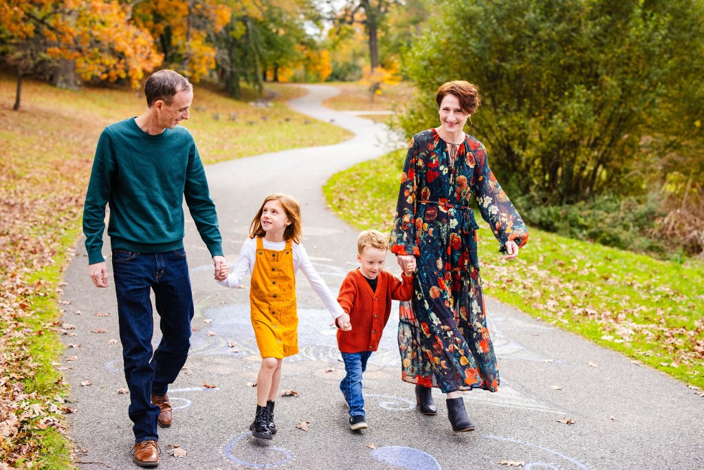 Family walking at their mini session in Roger Williams Park in Providence, RI