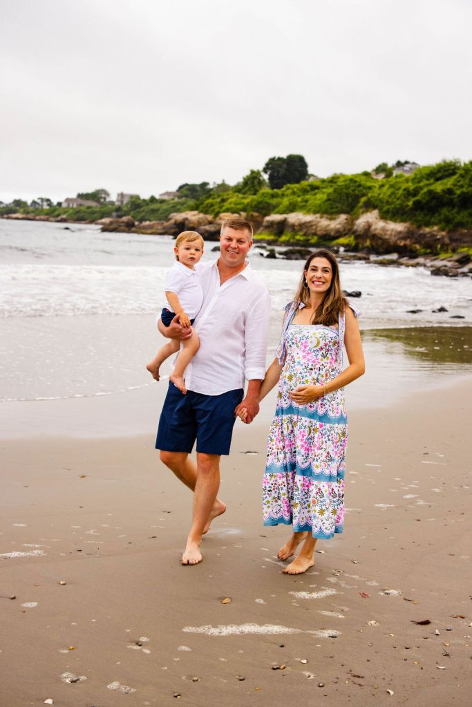 Family walking at Bonnet Shores Beach Club for family portrait in Narragansett, RI