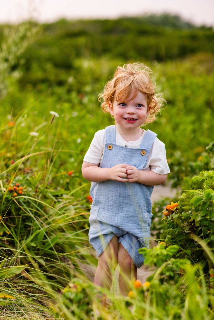 Kids in the dunes at their family portrait session in Narragansett with a RI family photographer in the point judith area