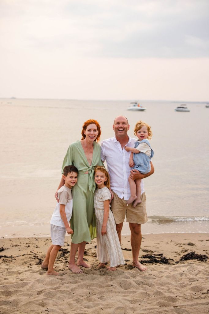 Family on the beach at their family portrait session in Narragansett with a RI family photographer in the point judith area