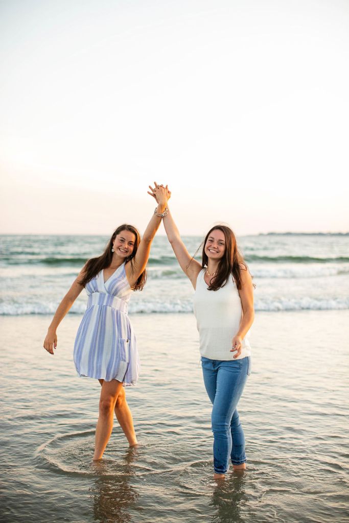 Girl poses for her senior session on the beach in Newport, RI