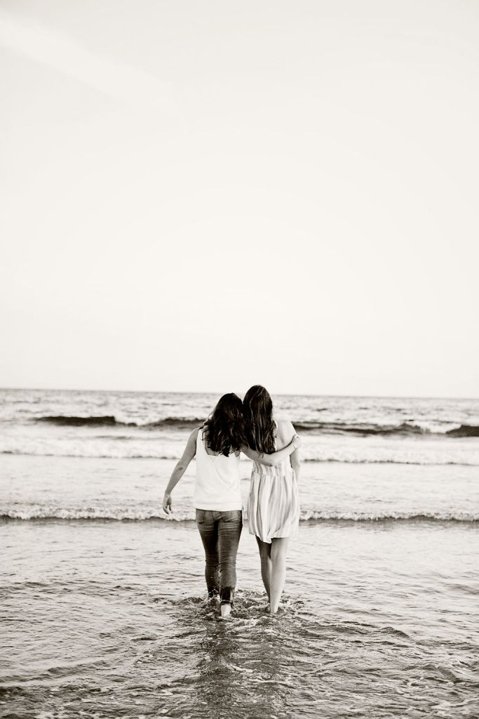 Girl poses for her senior session on the beach in Newport, RI