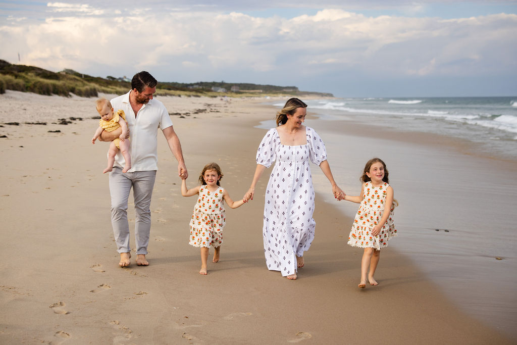 Family walks on the beach for their photo session on Block Island, RI