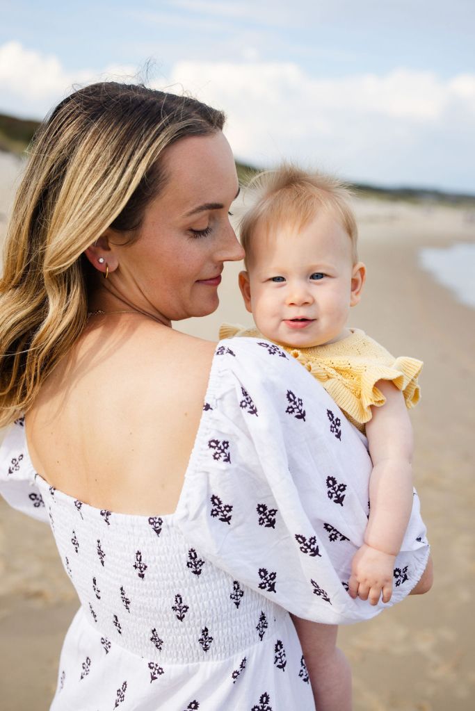 Mother and baby posing for beach session on the beach of block island in Rhode Island for phototgrapher
