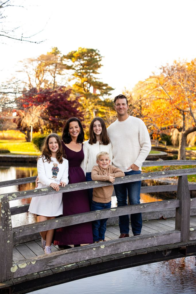 Family posing in Roger Williams Park in RI for their family portrait session