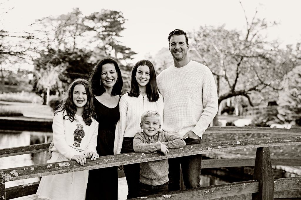 Family posing in Roger Williams Park in RI for their family portrait session