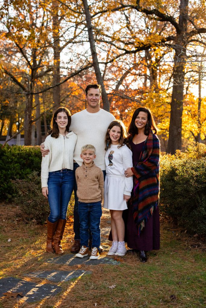 Family posing in Roger Williams Park in RI for their family portrait session