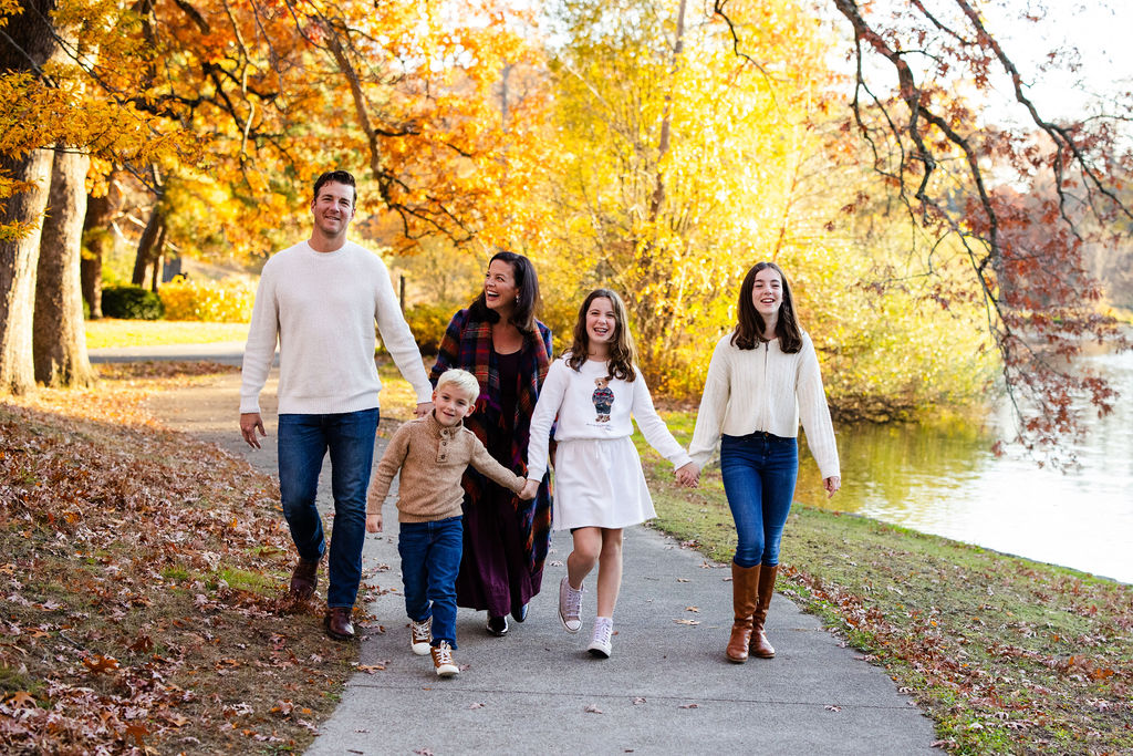 Family walking together in Roger Williams Park in RI for their family portrait session