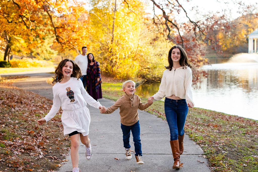 Family walking in Roger Williams Park in RI for their family portrait session