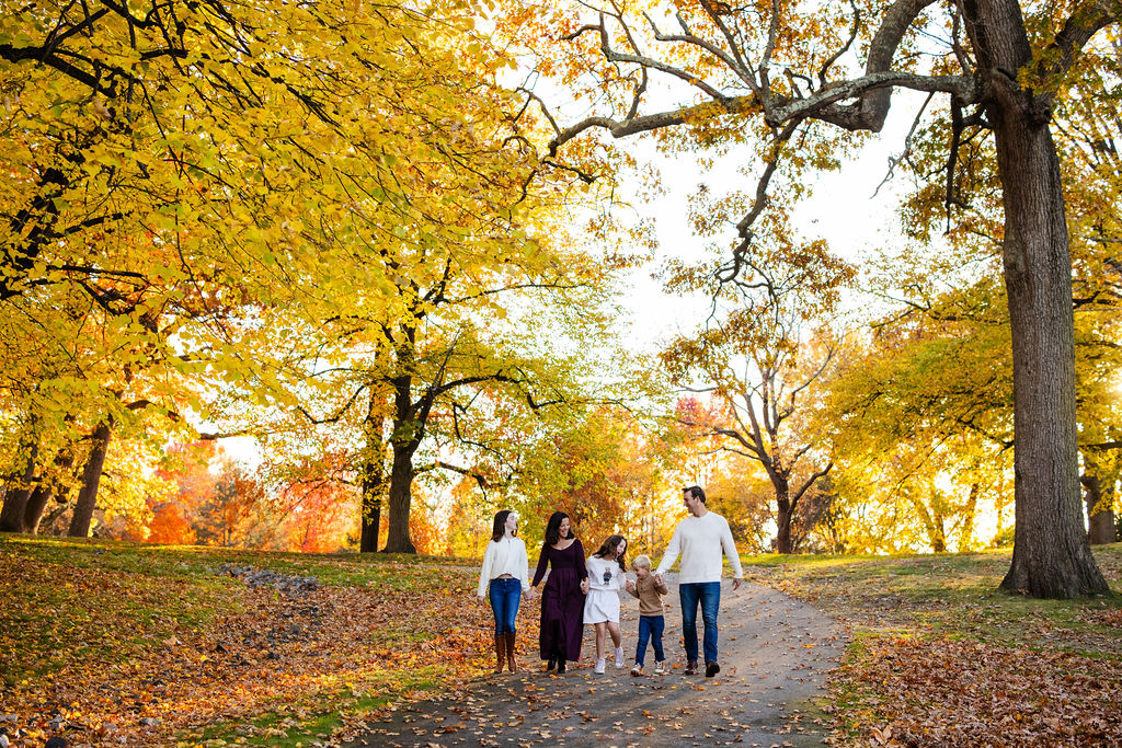 Family walking in Roger Williams Park in RI for their family portrait session